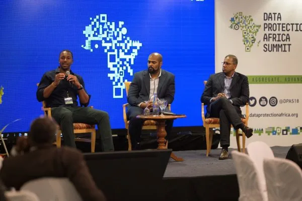 Dr Bright Mawudor, Michael Abtar and a fellow panellist seated on stage at the Data Protection Africa Summit.